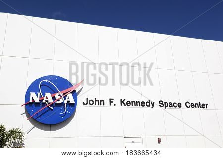 Facade Of Main Entrance For Tourists With John F. Kennedy Space Center And Nasa Emblem