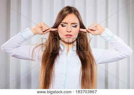 Stressed Woman With Closed Eyes Put Fingers In Ears,