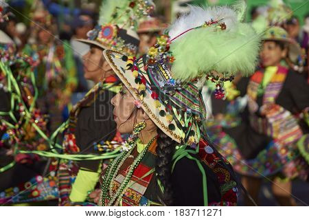 ARICA, CHILE - FEBRUARY 11, 2017: Tinkus dancers dressed in ornate costumes performing during a street parade at the annual Carnaval Andino con la Fuerza del Sol in Arica, northern Chile.