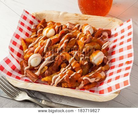Colombian food: typical salchipapas with quail eggs.