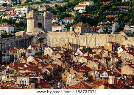 Protective city wall, Minceta tower and houses with red tiles in Dubrovnik, Croatia