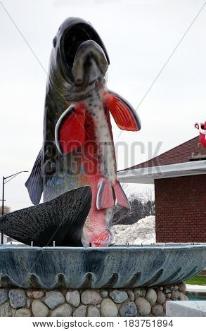 KALKASKA, MICHIGAN / UNITED STATES - NOVEMBER 27, 2016: The National Trout Memorial stands in front of the Kalkaska Historical Museum in downtown Kalkaska.