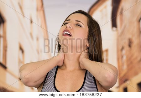 Beautiful lady Suffer crick after workout in the street.