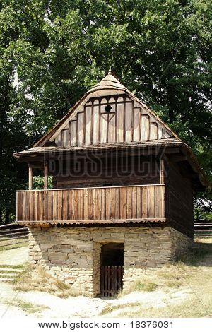 An old historic houses in museum â Roznov Skansen - Wallachian Village open air museum- in Czech republic in Europe under mountains by name Beskydy