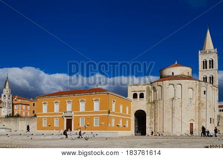ZADAR, JANUARY, 9 - People walking in front of Church of Saint Donate, Januaru, 9, 2017, Zadar, Croatia.