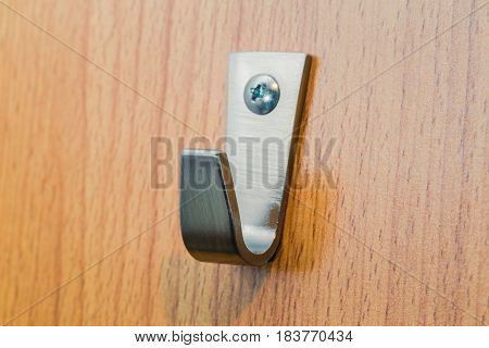 Metal Strong Hook. Steel Wall Hanger On Wood Background