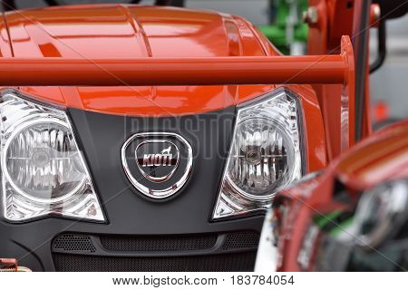 VILNIUS LITHUANIA - APRIL 27: Kioti heavy duty equipment vehicle and logo on April 27 2017 in Vilnius Lithuania. Kioti Tractor s the trade name for Daedong tractors in North America and Europe.