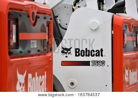 VILNIUS LITHUANIA - APRIL 27: Bobcat heavy duty equipment vehicle and logo on April 27 2017 in Vilnius Lithuania. Bobcat Company is an American-based manufacturer of farm and construction equipment.