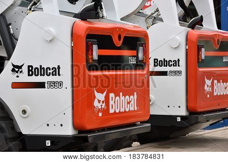 VILNIUS LITHUANIA - APRIL 27: Bobcat heavy duty equipment vehicle and logo on April 27 2017 in Vilnius Lithuania. Bobcat Company is an American-based manufacturer of farm and construction equipment.
