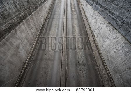Aerial view of underground car garage entrance concrete urban architecture geometry