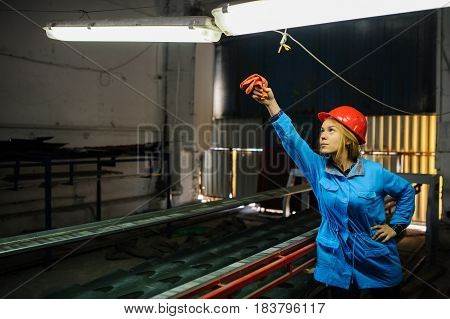 Beautiful Woman In Red Safety Helmet Work As Industrial Worker