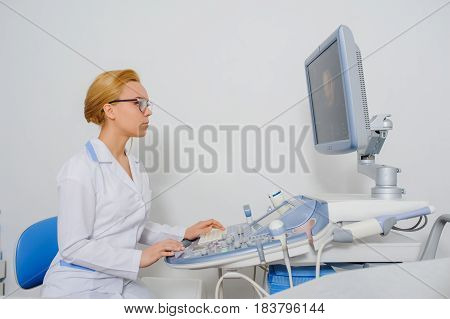 Doctor Analyze The Result Of Ultrasound Diagnostic Machine