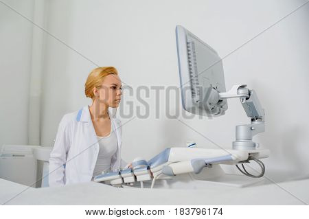 Doctor Analyze The Result Of Ultrasound Diagnostic Machine