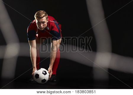 Professional Soccer Player Placing Ball For Penalty Kick