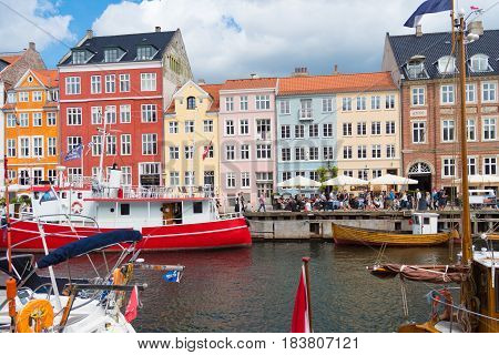 COPENHAGEN DENMARK - JULY 31 2016: Summer view of the famous Nyhavn with its colorful buildings