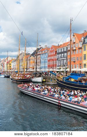 COPENHAGEN DENMARK - JULY 31 2016: Summer view of the famous Nyhavn with its colorful buildings