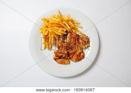 Fried Chicken With Fries On White Plate