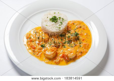 Souse Shrimp With Greens And Rice On A White Background