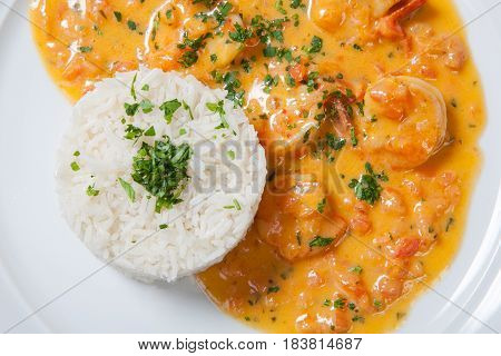 Souse Shrimp With Greens And Rice On A White Background