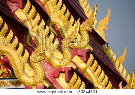Beautiful Nagas or Serpents (Giant snake) statue on the top of roof in 