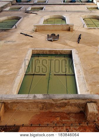 venice italy old window with green shutters