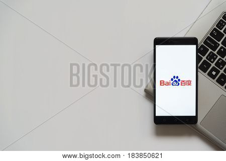 Bratislava, Slovakia, April 28, 2017: Baidu logo on smartphone screen placed on laptop keyboard. Empty place to write information.