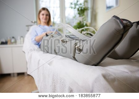Woman Receiving Slimming Lymphatic Drainage Treatment At Beautician's