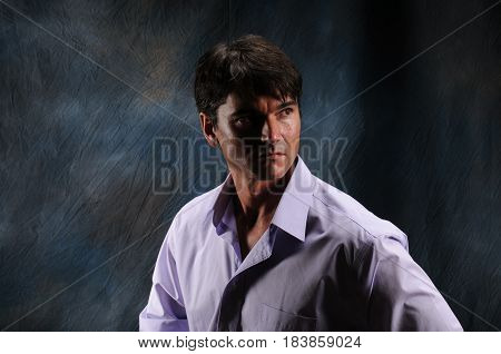 The handsome man is posing for a headshot.