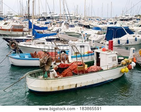 Fisherman System Networks On The Small Boat Moored In The Harbor