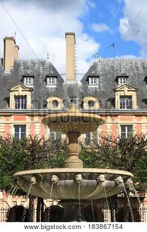 Fountain in Place des Vosges. Paris, France