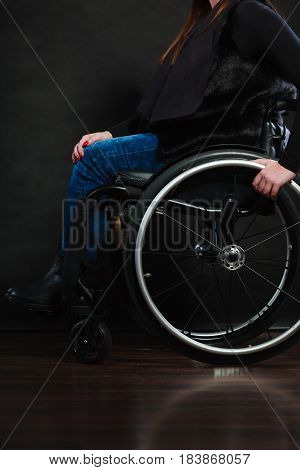 Disease disability paralysis handicap health concept. Legs of disabled person. Crippled female sitting on wheelchair.