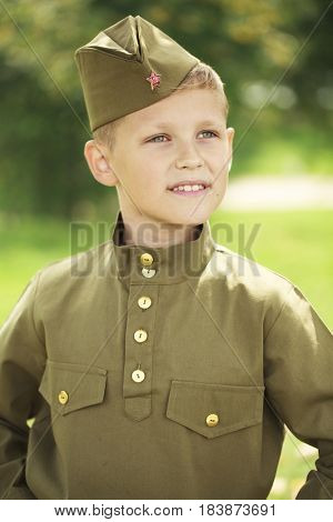 Russian boy in military uniform of the Soviet Army of the Second World War
