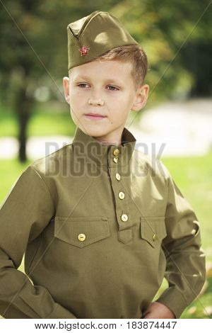 Russian boy in military uniform of the Soviet Army of the Second World War