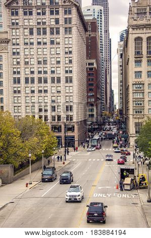 Chicago IL USA october 2016: Monroe street crossing Michigan avenue with traffic. Viewed from Nichols bridgeway in Chicago