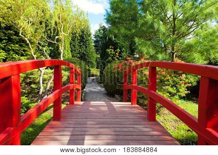 Red bridge in a beautiful Japanese Garden