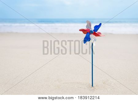 Independence Day USA background with decoration on the sandy beach near the ocean/ American patriotic concept