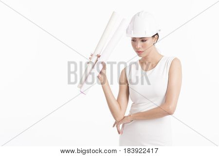 Sexy girl structural engineer holding drafting paper with copy space for product or text white background photo