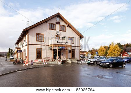 Roros Norway - September 29 2014: The Roros railroad station build with parked cars.