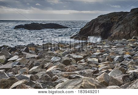 Stony Seashore Alongside Lofoten Islands in Norway During Sunset Hour. Horizontal Image