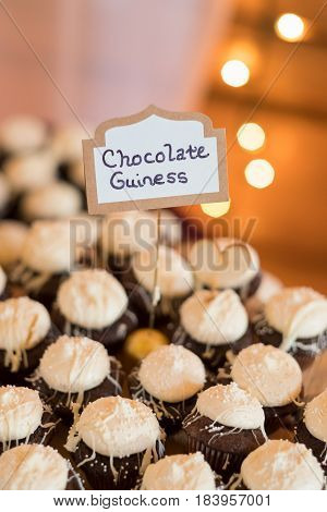 Bakery supplied chocolate guiness flavored tartletts for this wedding reception.