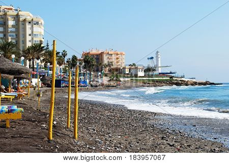 TORROX COSTA, SPAIN - OCTOBER 27, 2008 - View along the beach with yellow posts in the foreground Torrox Costa Malaga Province Andalusia Spain Western Europe, October 27, 2008.