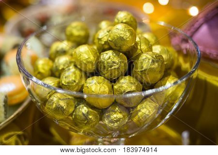 Golden Chocolate Bonbons In A Bowl