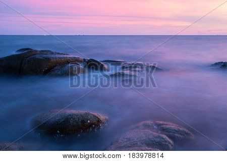 Long Exposure of Sunset at the sea Larn hin khao Rayong Thailand sunset at White rock beach Rayong