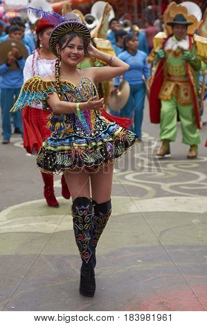ORURO, BOLIVIA - FEBRUARY 26, 2017: Morenada dance group in colourful outfits parading through the mining city of Oruro on the Altiplano of Bolivia during the annual Oruro Carnival.