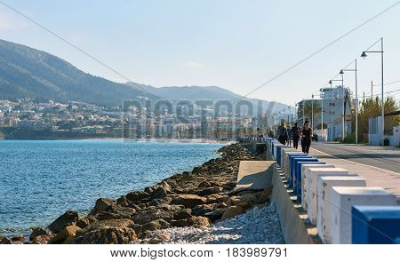 Altea Spain - April 8 2017: People walking along the seafront in the resort town of Altea the most beautiful place in the Costa Blanca. Spain