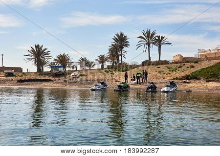 Island of Tabarca Spain - March 11 2017: Jet ski and people on the harbor of Tabarca Island. Spain