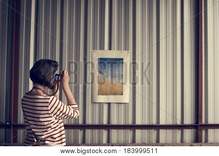 Woman traveler photographer holiday lifestyle trip