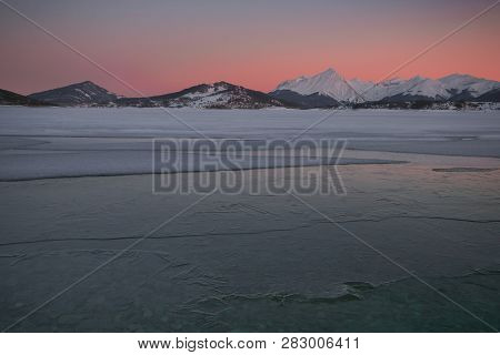 Wonderful Sunset Over Campotosto Dam With Snow In Abruzzo