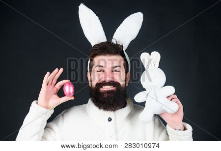 Soft And Tender. Guy With Long Bunny Or Rabbit Ears On Black Background. Enjoy Tenderness. Easter Vi