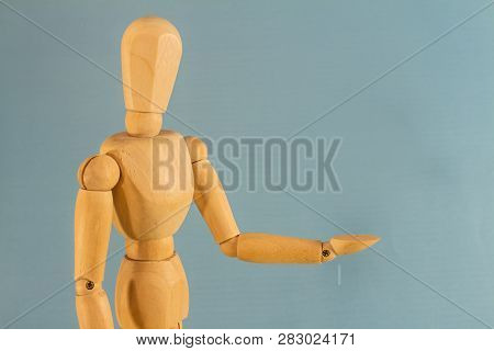 Wooden Doll As A Model For Drawing On A Neutral Background. Concept Of Asking For Help, Sadness, Lon